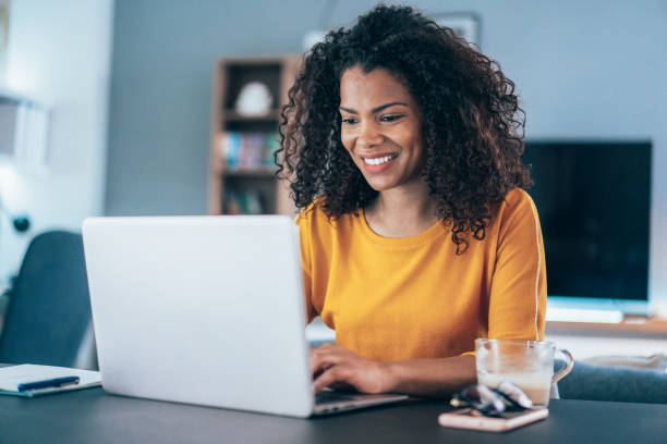 Updating MetaMetrics econometric model - lady using laptop