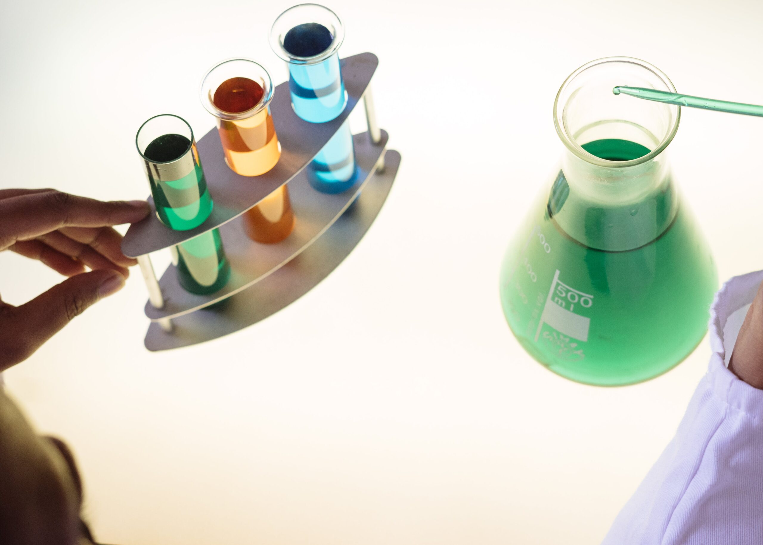Chemistry bottles with different coloured liquids - testing econometric models